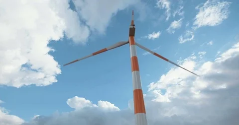 Large wind turbine spinning with clouds in the background Stock Footage 71298873