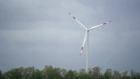 Large wind turbines with blades in field aerial view bright orange sunset blue Stock Footage 155645657