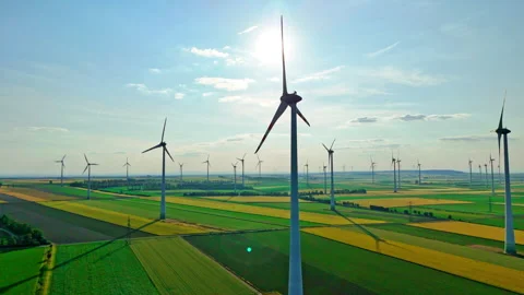 Large wind turbines with blades in field aerial view. Windmills farm for energy Stock Footage 313378886