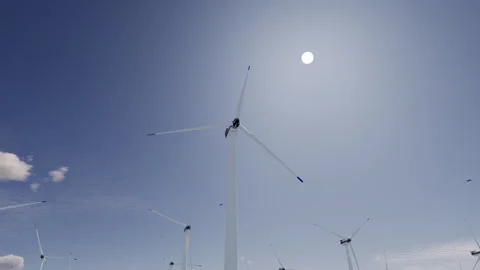 Large wind turbines generate electricity Stock Footage 284024706