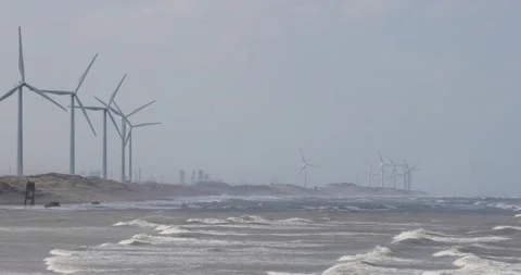 Large wind turbines producing plant on the sea Stock Footage 237906019