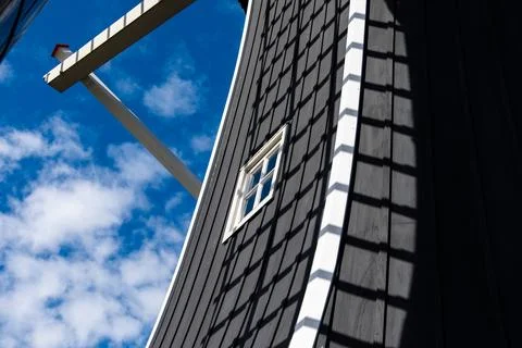 A large windmill with a window on the side Foto stock