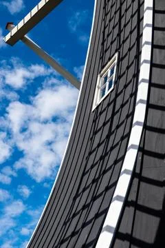 A large windmill with a window on the side Stock Photos