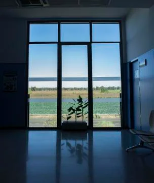 Large window from floor to ceiling to green farmland Stock Photos