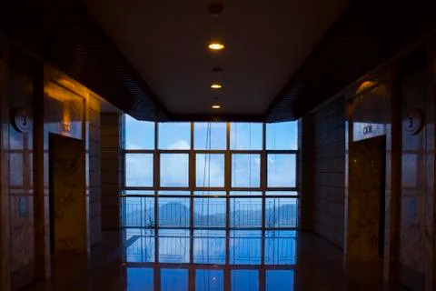 Large window with reflection during the morning and people in frame. Stock Photos