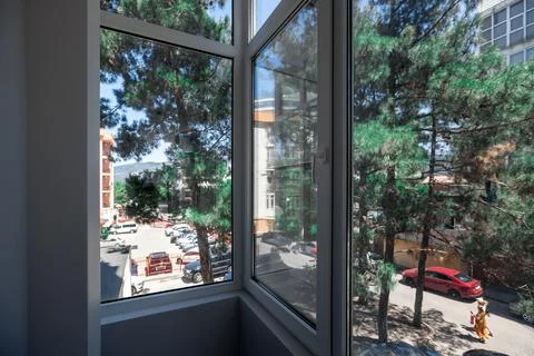 A large window with a view of a city street Stock Photos