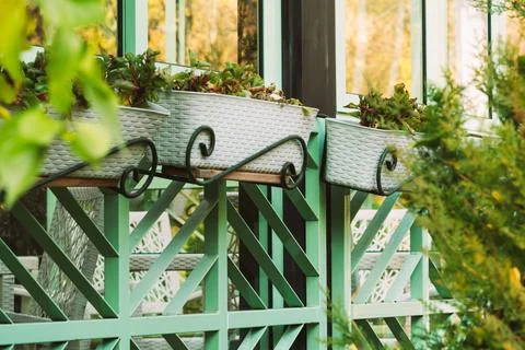 Large windows with pots in a cafe outside Stock Photos