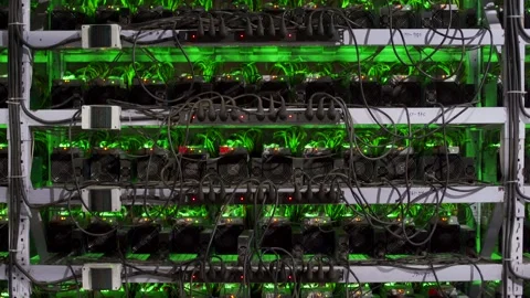Large wired internet datacenter storage. ASIC miners on stand racks mine bitcoin Stock Footage 131313691