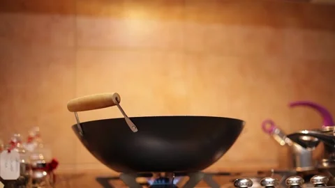 Large wok and kitchen in the background Vídeo Stock 131973293