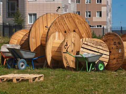 Large wooden cable spools of various sizes Stock Photos