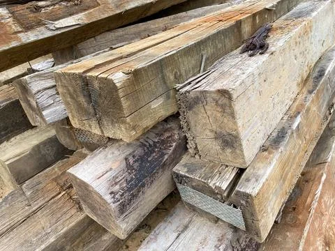 Large wooden rectangular logs or large diameter square cross ties at a constr Stock Photos