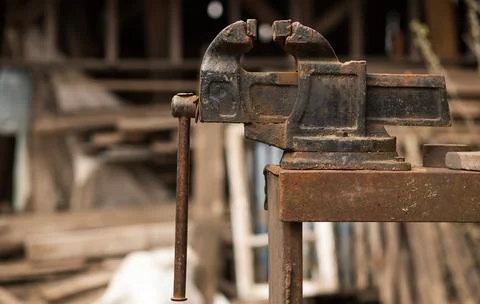Large work vise Large locksmith vise in the workshop Concept: tool, work, pro Stock Photos