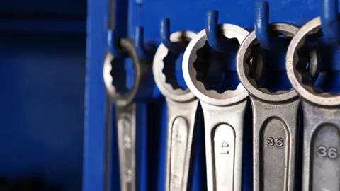 Large wrench hanging in an organized tool rack.  Stock Footage 304067720