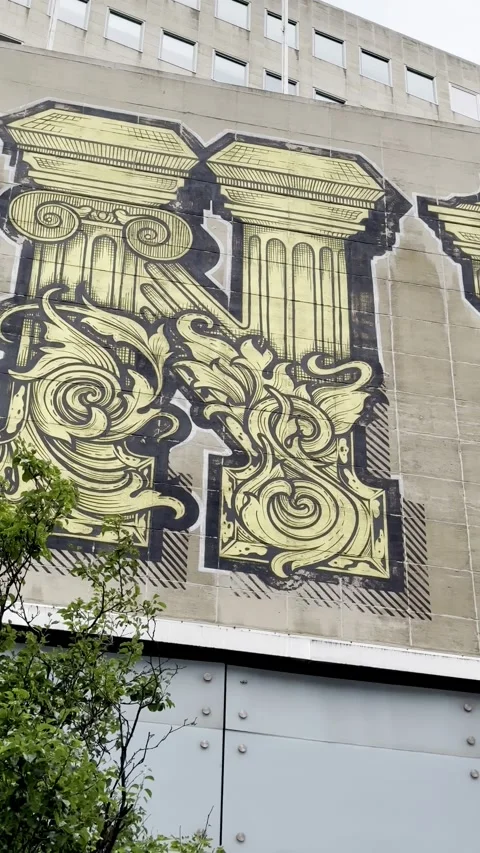 Large yellow and black graffiti mural spelling out Antwerpen. Video stock 343877573