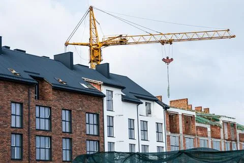 Large yellow construction crane. Construction site background Stock Photos