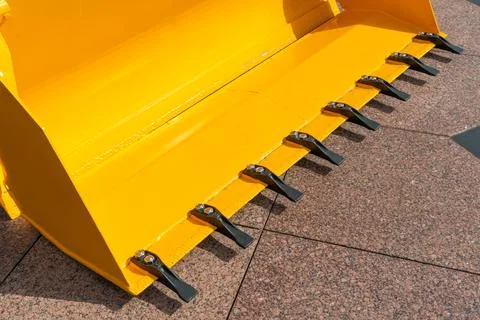 A large yellow construction excavator on a construction site. A new quarry bu Stock Photos