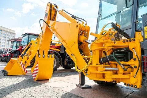 A large yellow construction excavator on a construction site. A new quarry bu Stock Photos