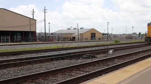 Large yellow freight train pulling into station Stock Footage 65257804