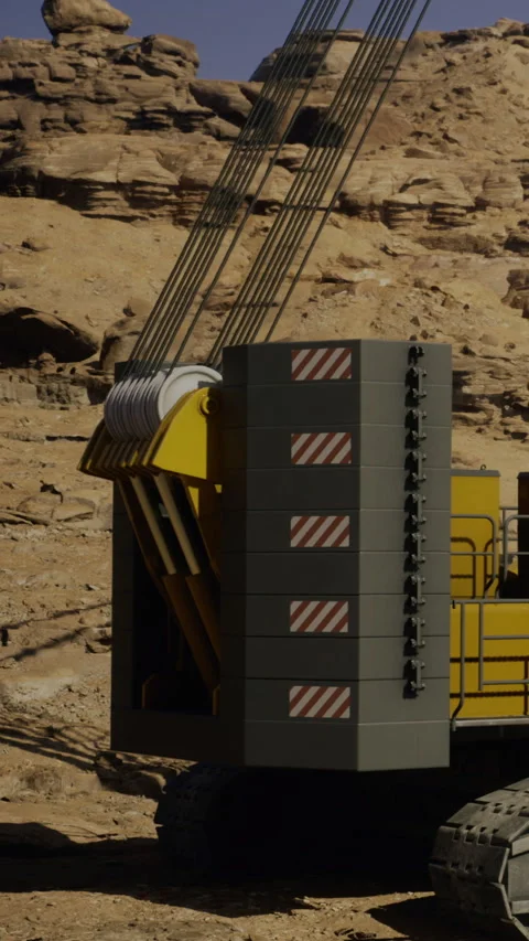 A large yellow machine works on uneven ground in a desert setting Stock Footage 331708898
