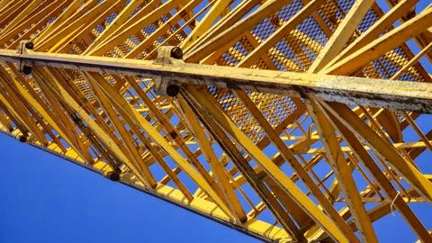 A large yellow structure with a blue sky in the background Stock Photos
