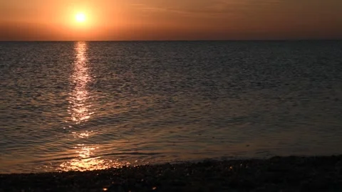 Large Yellow Sun Over Deep Blue Sea Waves - Sunset at Possidi Cape Beach Greece Video stock 330497033
