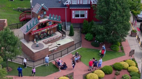 Largest Cuckoo Clock Performance Outside Red Building With Visitors in 스톡 동영상 316109358