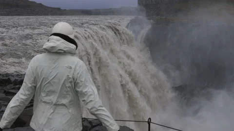 The largest, mighty and beautiful waterfall in Iceland, Dettifoss, female hiker Видео 227904929