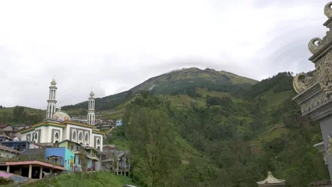 Largest Mosque of Nepal Van Java Village with Mount Sumbing Background  Mag.. Stock Footage 322174720