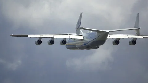 The largest plane in the world against the blue sky, slow motion Stock Footage 128411894