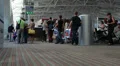 Larnaca airport hall with passengers boarding on aircraft through reception HD Footage