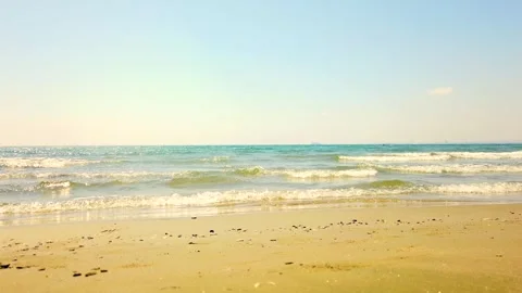 Larnaca Beach With Distant Ship and Waves on Golden Sands Stock Footage 345918555
