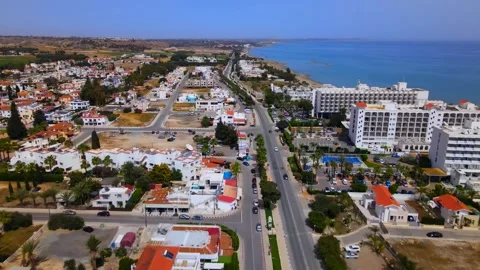 Larnaca , Cyprus - 03 05 2025: Summer view from above on a coastal hotel Stock Footage 309405422