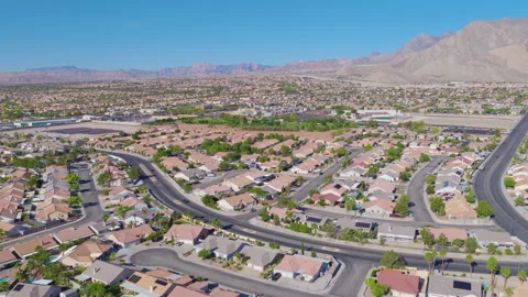 Las Vegas Aerial Pullback View of Suburban Homes and Desert Mountains Video stock 334635257