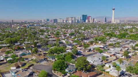 Las Vegas Aerial Pullback View of Strip Skyline Over Residential Neighborhood 01 Stock Footage 334684207