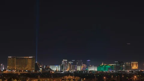 Las Vegas strip city skyline and airplanes, helicopters at night timelapse Stock Footage