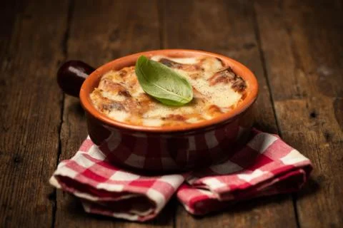 Lasagna dish on a rustic table. Food, mozzarella. Stock Photos
