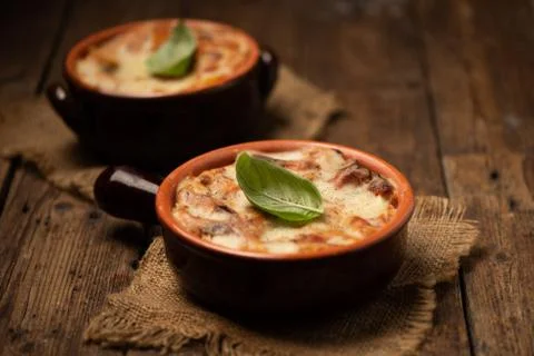 Lasagna dish on a rustic table. Food, mozzarella. Stock Photos