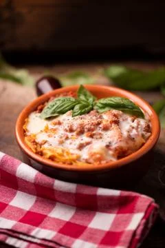Lasagna dish on a rustic table Stock Photos