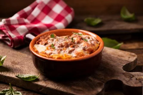 Lasagna dish on a rustic table Stock Photos