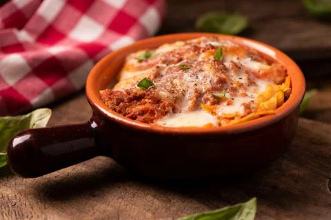 Lasagna dish on a rustic table Foto stock