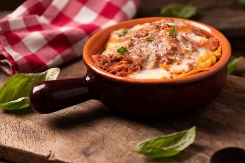 Lasagna dish on a rustic table Stock Photos