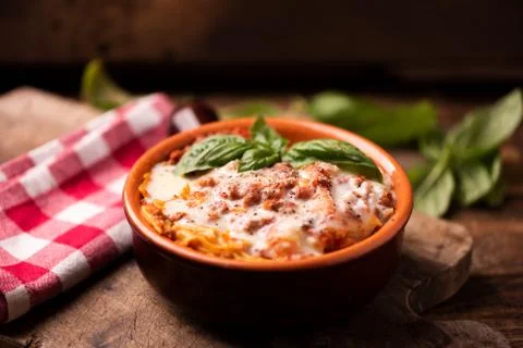 Lasagna dish on a rustic table Stock Photos