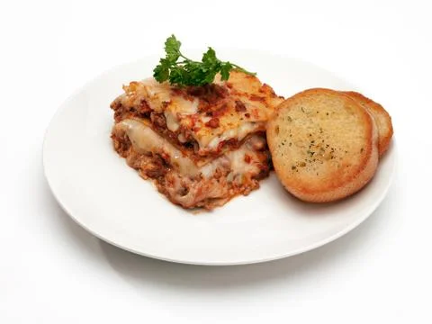 Lasagna with garlic bread Stock Photos