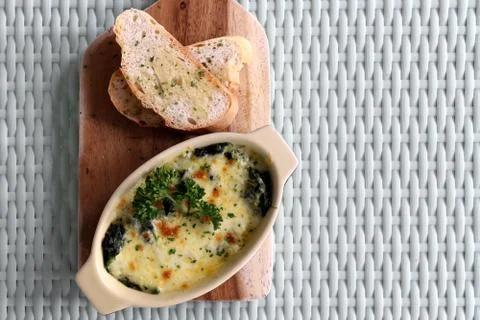 Lasagna with garlic bread Stock Photos
