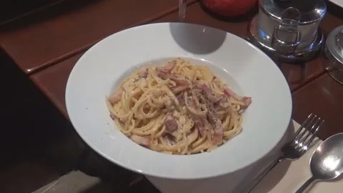 Lasagna on a plate aside with fork and knifes Stock Footage 94286273