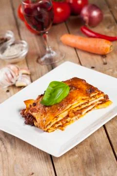 Lasagna portion on a white plate Stock Photos
