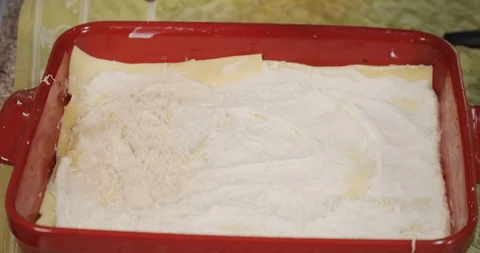 Lasagna Preparation With Grated Cheese Stock Footage 128917785