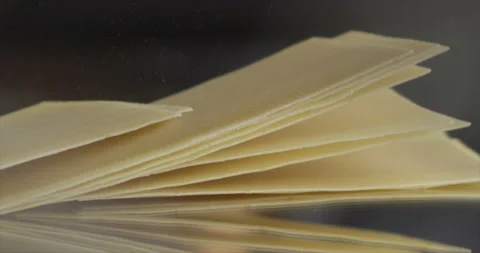 Lasagna sheets falling on a mirror surface Stock Footage 198560802