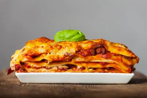Lasagna on a white plate Stock Photos