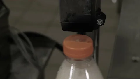 Laser application of the production date on the lid of the dairy product Stock Footage 170668009